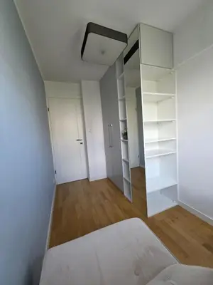 Łóżko lub łóżka w pokoju w obiekcie Apartament JP2 Central Spot