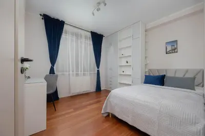 Łóżko lub łóżka w pokoju w obiekcie Family Apartment with 3 Bedrooms and a Parking Space by Noclegi Renters
