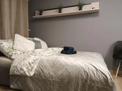 Łóżko lub łóżka w pokoju w obiekcie Bliska Ochota Apartment