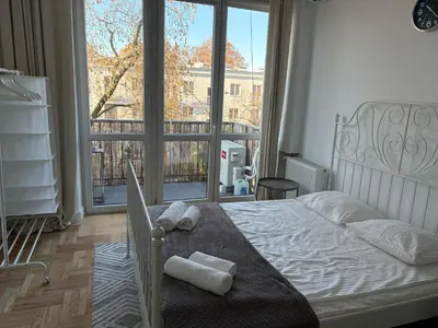 Łóżko lub łóżka w pokoju w obiekcie Apartament Paryska