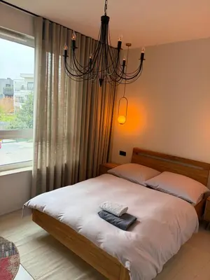 Łóżko lub łóżka w pokoju w obiekcie BlaBlaFlat Warszawa Aura Mokotów