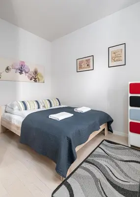 Łóżko lub łóżka w pokoju w obiekcie RentPlanet - Apartament Metro Młociny