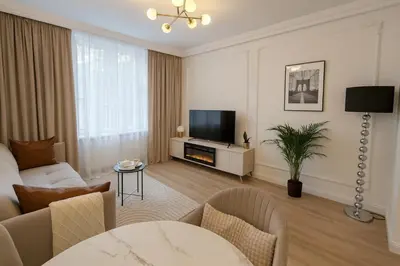 Telewizja i/lub zestaw kina domowego w obiekcie Gold apartment in the Old Town