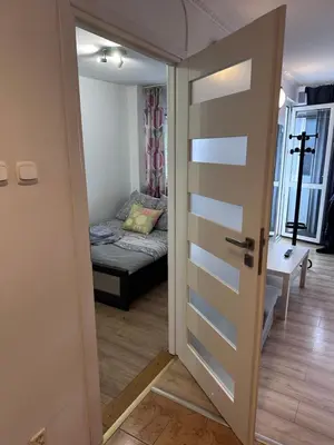 Łóżko lub łóżka w pokoju w obiekcie Sahara Apartment Centrum