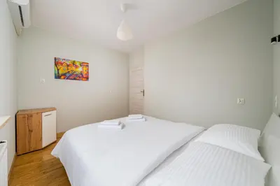 Łóżko lub łóżka w pokoju w obiekcie Warszawa Gocławek Spacious Apartment by BookingHost