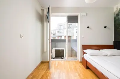 Łóżko lub łóżka w pokoju w obiekcie Warszawa Gocławek Spacious Apartment by BookingHost