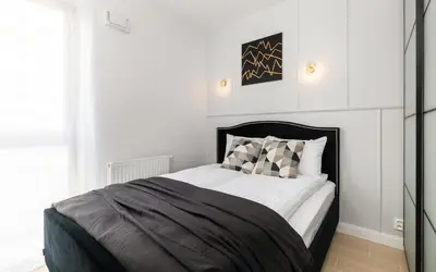 Łóżko lub łóżka w pokoju w obiekcie Modern Apartment Warsaw Burakowska By Noclegi Renters