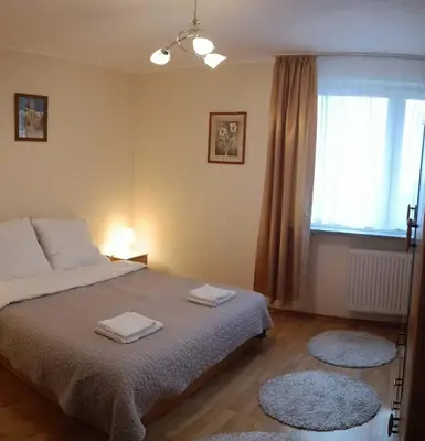 Łóżko lub łóżka w pokoju w obiekcie Apartament Bluehouse