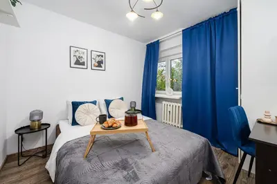 Łóżko lub łóżka w pokoju w obiekcie Lumina 3 room apartment in Warsaw