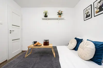 Łóżko lub łóżka w pokoju w obiekcie Lumina 3 room apartment in Warsaw