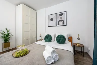 Łóżko lub łóżka w pokoju w obiekcie Lumina 3 room apartment in Warsaw