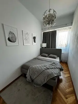 Łóżko lub łóżka w pokoju w obiekcie Downtown Place Apartment