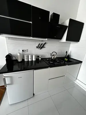 Kuchnia lub aneks kuchenny w obiekcie Downtown Place Apartment