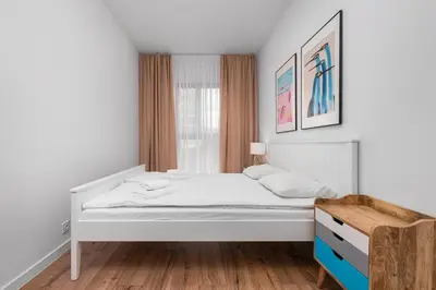 Łóżko lub łóżka w pokoju w obiekcie Białej Koniczyny 5 by Homeprime