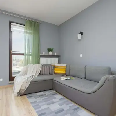 Grey Apartment in Warsaw with City View and Balcony by Noclegi Renters