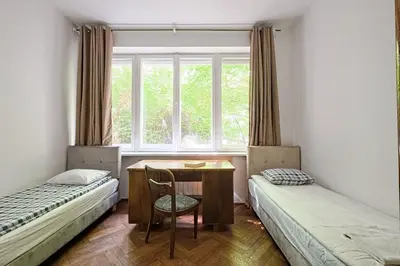 Łóżko lub łóżka w pokoju w obiekcie Urban Nest Group - Wilcza 69