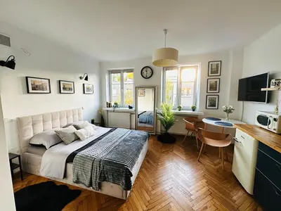 Łóżko lub łóżka w pokoju w obiekcie Koźla old town apartment