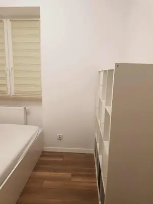 Łóżko lub łóżka w pokoju w obiekcie Metro Racławicka Apartments