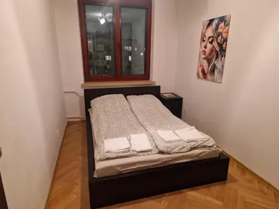 Łóżko lub łóżka w pokoju w obiekcie Apartament Maklakiewicza 11