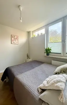Łóżko lub łóżka w pokoju w obiekcie Cozy Stay Saska Kępa