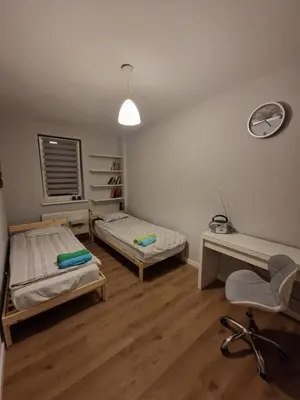 Łóżko lub łóżka w pokoju w obiekcie Apartament Jana