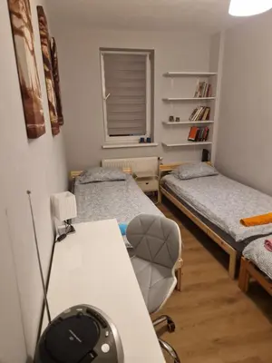 Łóżko lub łóżka w pokoju w obiekcie Apartament Jana