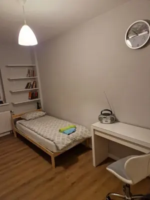 Łóżko lub łóżka w pokoju w obiekcie Apartament Jana