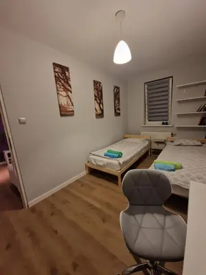 Łóżko lub łóżka w pokoju w obiekcie Apartament Jana