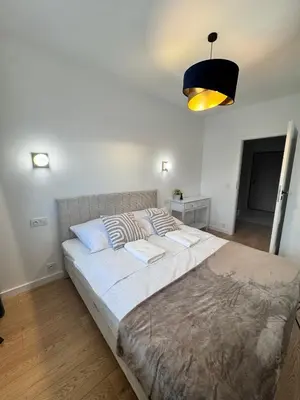 Łóżko lub łóżka w pokoju w obiekcie Forest Apart VIII Aleje Jerozolimskie