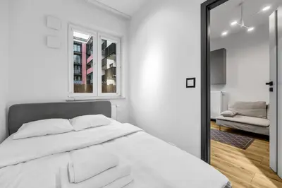 Łóżko lub łóżka w pokoju w obiekcie Kłobucka Deluxe Apartment by BookingHost
