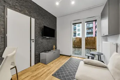 Telewizja i/lub zestaw kina domowego w obiekcie Kłobucka Deluxe Apartment by BookingHost