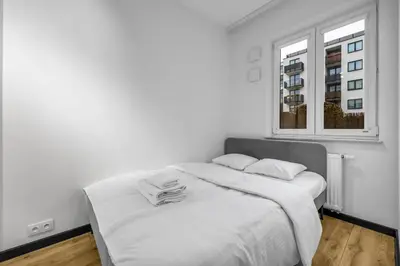 Łóżko lub łóżka w pokoju w obiekcie Kłobucka Deluxe Apartment by BookingHost
