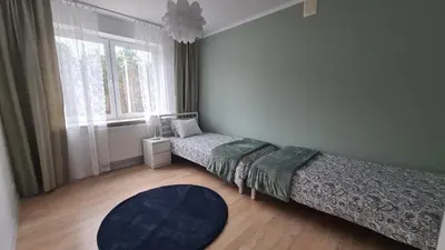 Łóżko lub łóżka w pokoju w obiekcie Apartament Leśny Ząbki