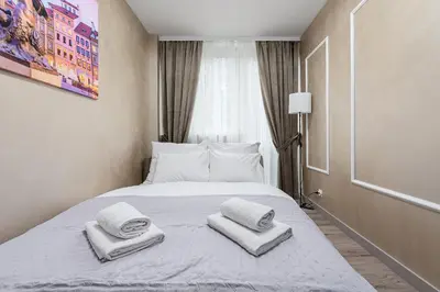 Łóżko lub łóżka w pokoju w obiekcie P&O Serviced Apartments Grzybowska 5