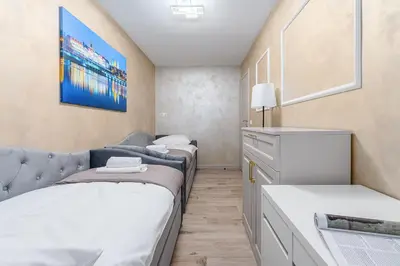 Łóżko lub łóżka w pokoju w obiekcie P&O Serviced Apartments Grzybowska 5