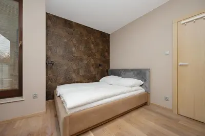Łóżko lub łóżka w pokoju w obiekcie Ordona Modern Apartment by Solarento