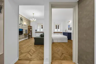 Łóżko lub łóżka w pokoju w obiekcie Warsaw Heartline Apartment by BookingHost