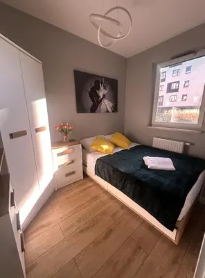 Łóżko lub łóżka w pokoju w obiekcie CityLine Apartment Nova Ochota