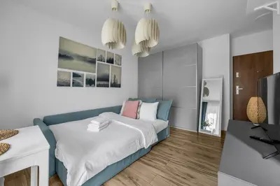 Łóżko lub łóżka w pokoju w obiekcie Podskarbińska Modern Space Studio by BookingHost