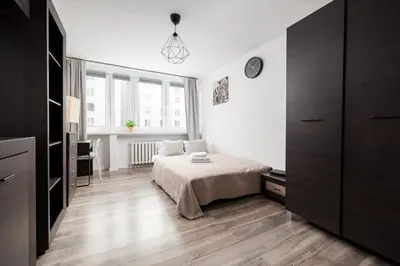 Łóżko lub łóżka w pokoju w obiekcie Śródmieście City Pulse Studio by BookingHost