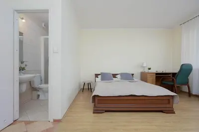 Łóżko lub łóżka w pokoju w obiekcie Family Apartment with Balcony and Remote Work in Warsaw by Noclegi Renters
