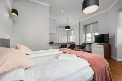 Łóżko lub łóżka w pokoju w obiekcie Nowy Świat 29 by Homeprime