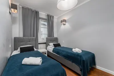 Łóżko lub łóżka w pokoju w obiekcie Nowy Świat 29 by Homeprime