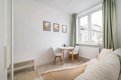 Łóżko lub łóżka w pokoju w obiekcie Tamka Powiśle Green Studio by BookingHost