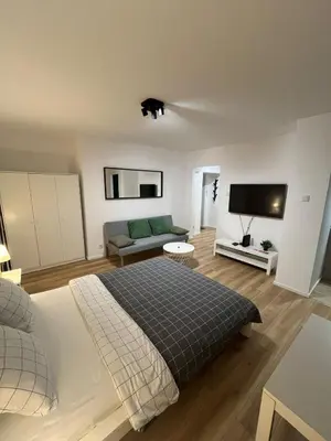 Łóżko lub łóżka w pokoju w obiekcie Top CityCenter Modern Nowogrodzka