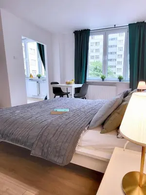 Łóżko lub łóżka w pokoju w obiekcie Top CityCenter Modern Nowogrodzka