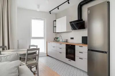Kuchnia lub aneks kuchenny w obiekcie Marywilska Homely Apartment by BookingHost