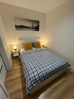 Łóżko lub łóżka w pokoju w obiekcie Top CityCentre Amazing Nowogrodzka