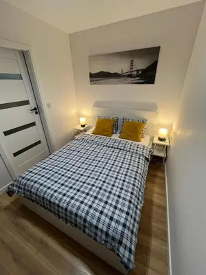 Łóżko lub łóżka w pokoju w obiekcie Top CityCentre Amazing Nowogrodzka