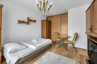 Łóżko lub łóżka w pokoju w obiekcie Bielany Standard Apartment by BookingHost